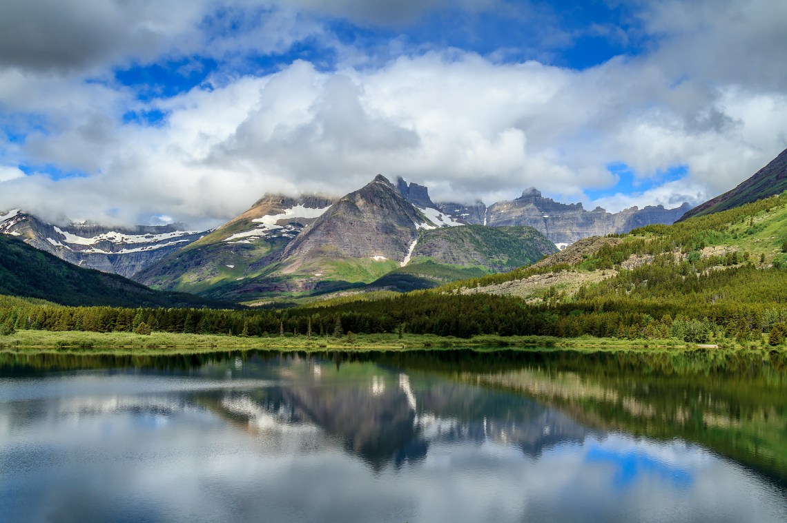 Mount Wilbur and Swiftcurrent Mountain shrouded in clouds
